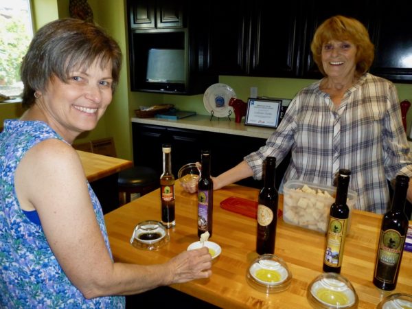 Women sampling olive oils