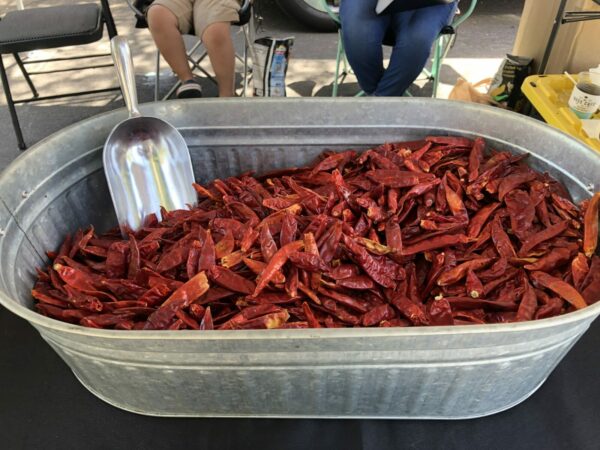 bucket of chili peppers at farmers market